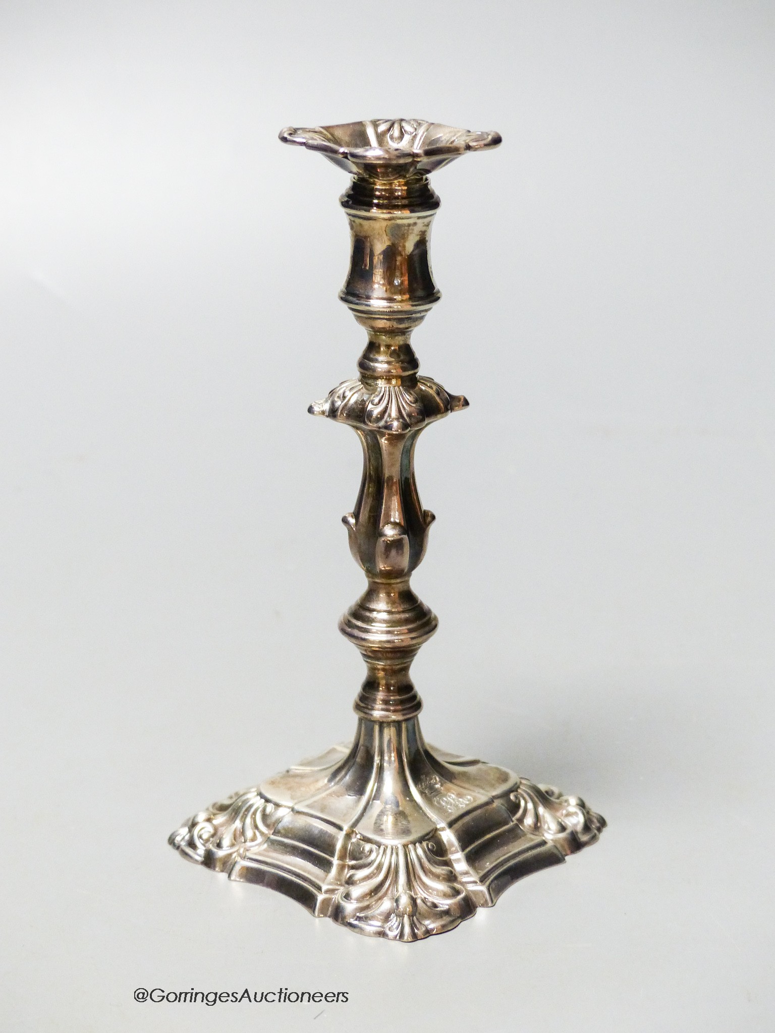 A William IV silver taperstick, with waisted knopped stem and engraved monogram below a coronet, Kitchen & Walker, Sheffield, 1835, 13.8cm, 121 grams.